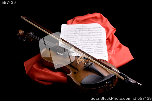 Image of violin on scarlet silk