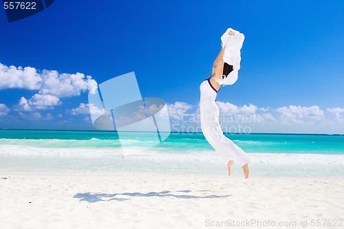 Image of happy woman with white sarong