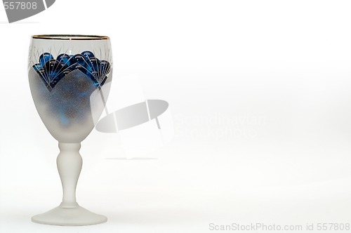 Image of wineglass and blue spheres