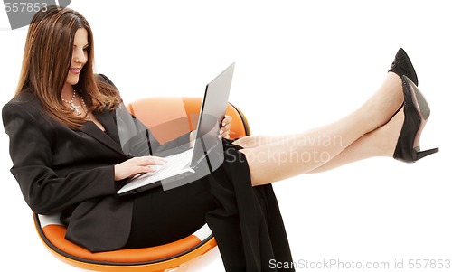 Image of businesswoman in chair with laptop