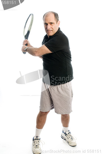 Image of happy middle age man playing tennis