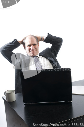 Image of corporate business senior executive relaxing in office