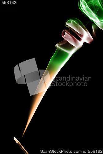 Image of Stick with a color smoke. Isolated on black