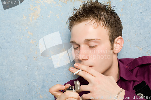 Image of portrait of the young man with a cigarette