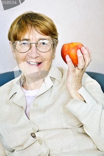 Image of Elderly woman with apple
