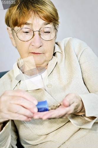 Image of Elderly woman with medication