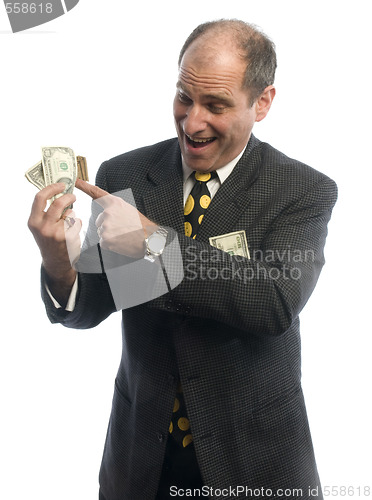 Image of man middle age rolling in cash