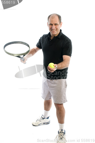 Image of active senior man playing tennis with beer belly