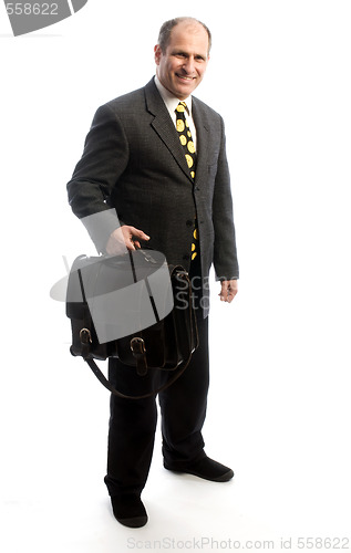 Image of senior corporate executive traveling with leather bag