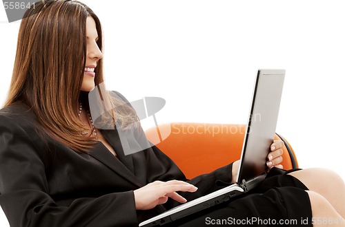 Image of businesswoman in chair with laptop