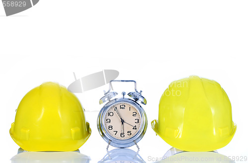 Image of alarm clock and helmet 