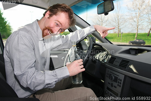 Image of drivers with a bottle alcohol