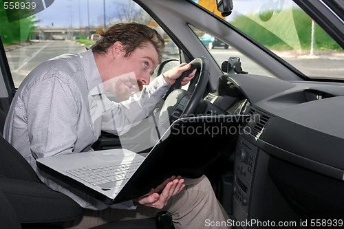 Image of driver using GPS laptop
