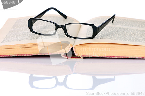 Image of book and eyeglasses 