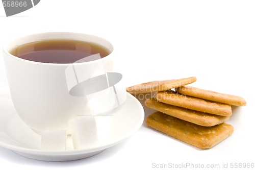 Image of cup of tea, sugar and cookies