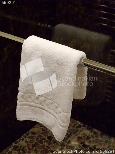 Image of TOWEL HANGING IN A  BATHROOM