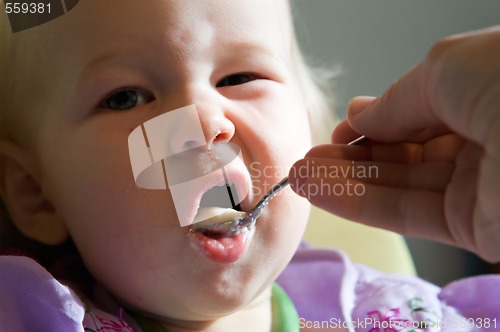 Image of child eating pap