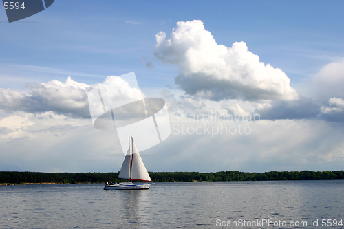 Image of Recreation time. A family in the yacht is sailing