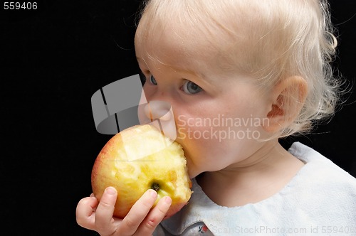 Image of girl bitting apple