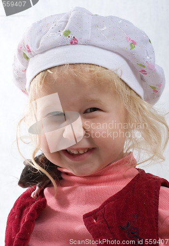 Image of smiling baby with rat