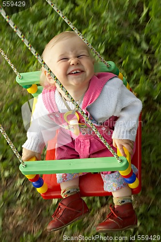 Image of child on swing