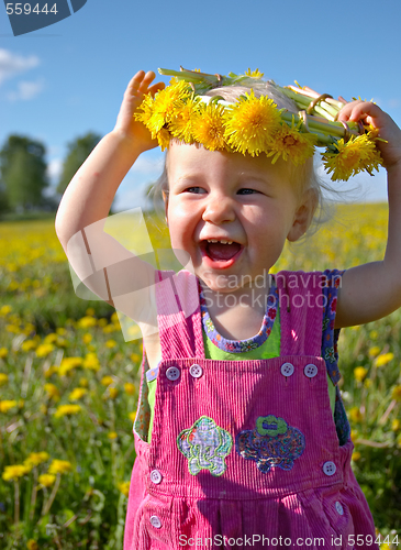 Image of happy girl with dandelion wreath