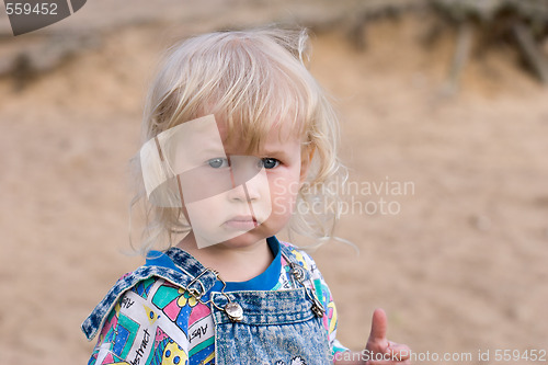 Image of blonde sad little girl