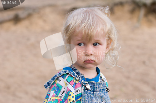 Image of blonde sad little girl