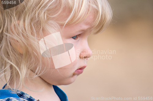 Image of blonde sad little girl