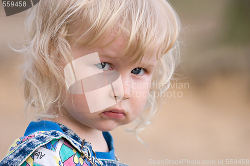 Image of blonde sad little girl