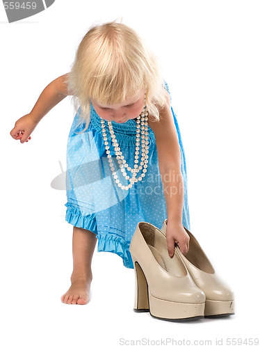 Image of little girl with big shoes