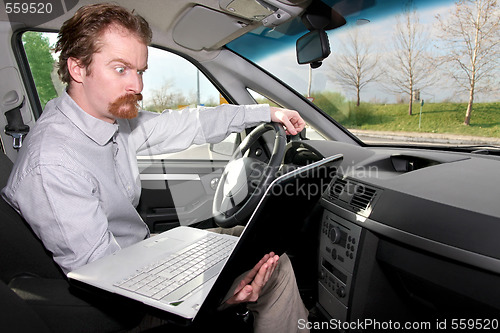 Image of driver using gps laptop