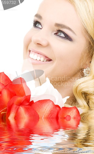 Image of happy woman with lily flowers