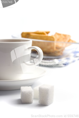 Image of cup of tea, sugar and cookies