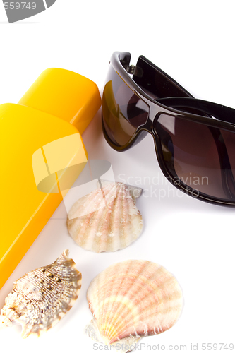 Image of sunglasses and lotion