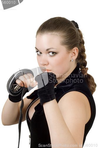 Image of Pretty angry young woman throwing a punch. Isolated