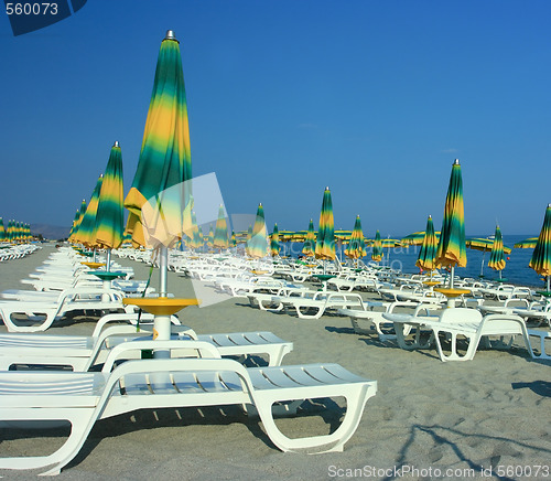 Image of Beach with folded umbrellas