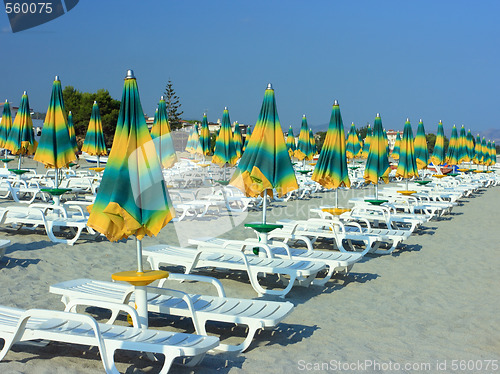 Image of Beach with folded umbrellas