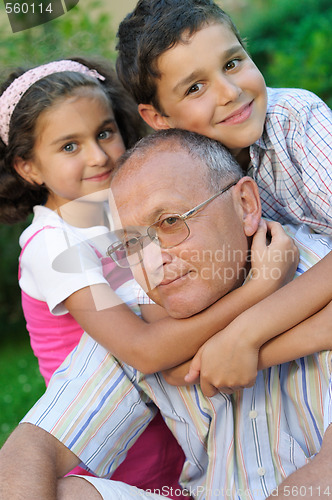 Image of Happy grandfather and kids