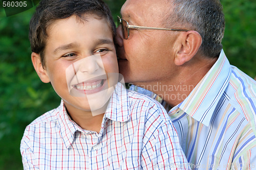 Image of grandfather and kid outdoors