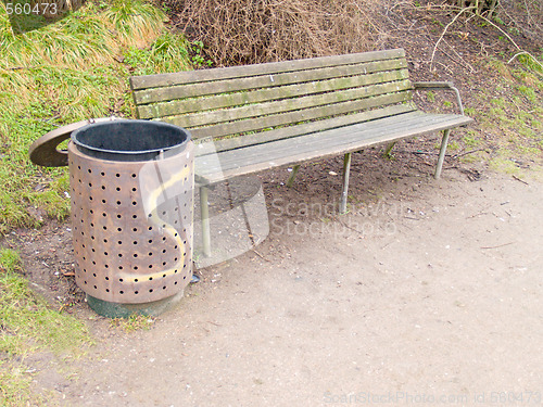 Image of A peaceful bench and rubbish bin in a park