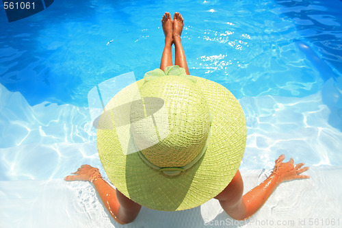 Image of Young woman in a swimming pool
