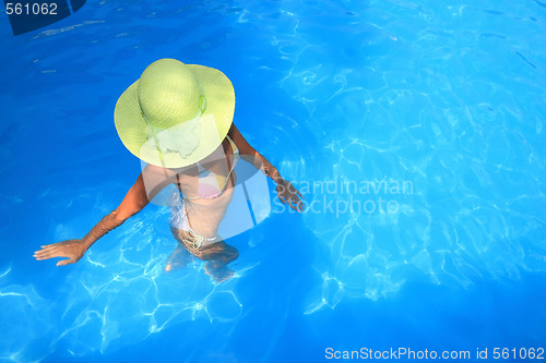 Image of Young woman  in a swimming pool