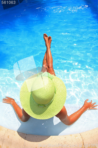 Image of Young woman in a swimming pool