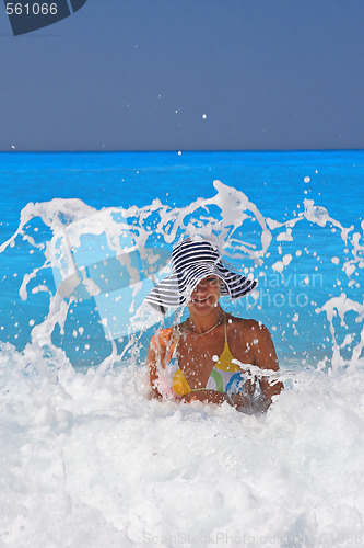 Image of Pretty blonde woman enjoying the Ionian sea in Greece