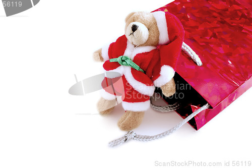 Image of santa teddy resting on a bag