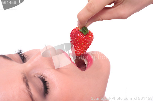 Image of Beautiful girl holding strawberry 