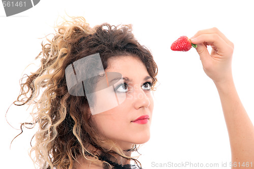 Image of Beautiful girl holding strawberry 