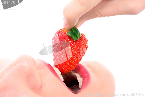 Image of Beautiful girl holding strawberry 