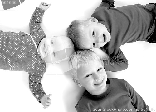 Image of Three children lying on the floor